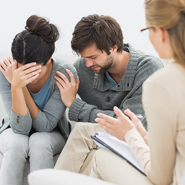 displeased-couple-meeting-with-financial-adviser 1